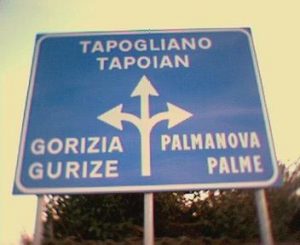 Road sign in Friulian